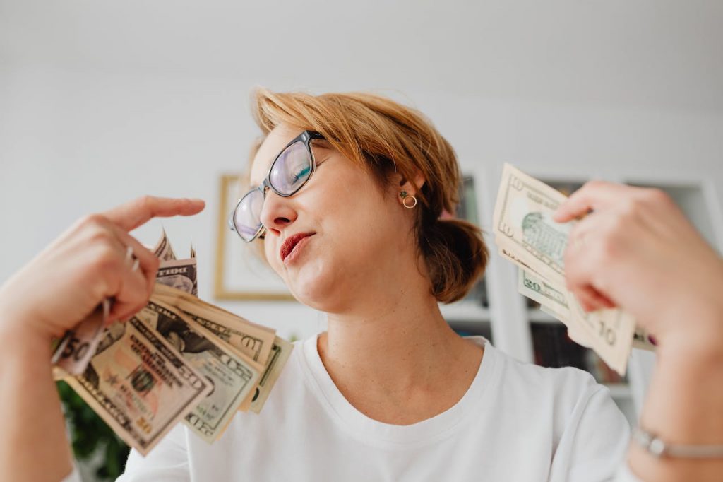 women-with-money-in-hand-money-management