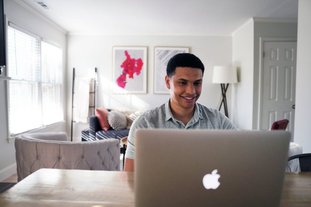 man-looking-computer-smiling