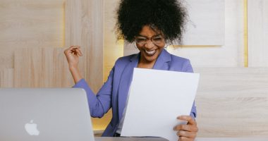 women-reading-documents-happy -face