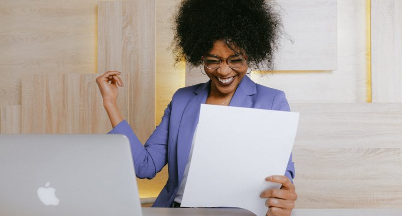 women-reading-documents-happy -face